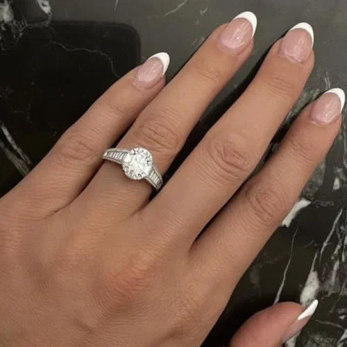 Watters 1.47 Carat Oval and Baguette Diamond Halo Ring in 18K White Gold — view 3